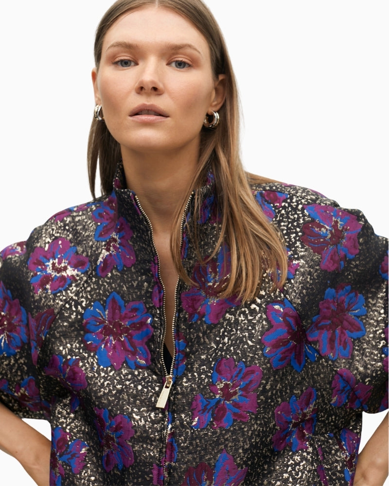 Close-up of floral jacquard fabric with metallic shimmer