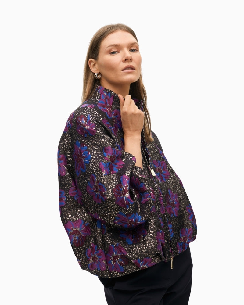 Side view showing raised collar and zip closure on bomber