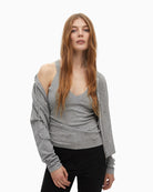 Grey knit gilet by Lola Casademunt with pearl bead detail and hood