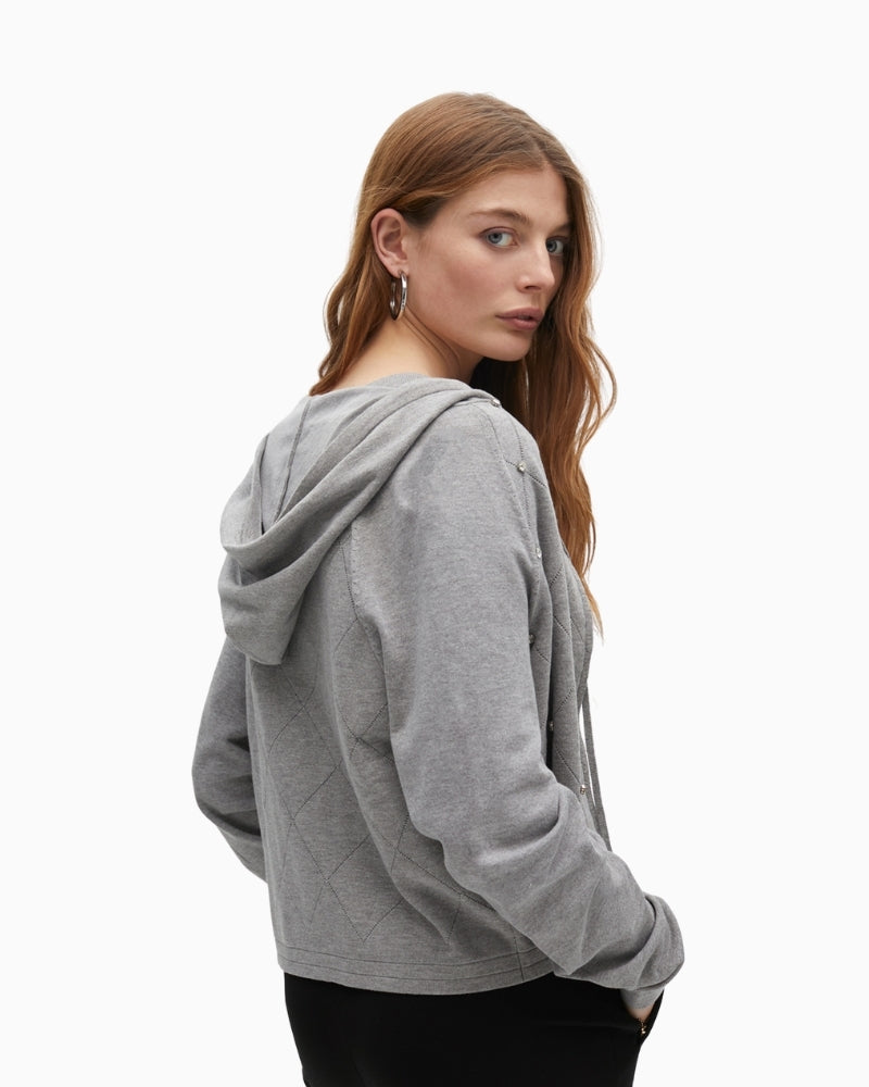 Side view of hooded cardigan with long sleeves and relaxed fit