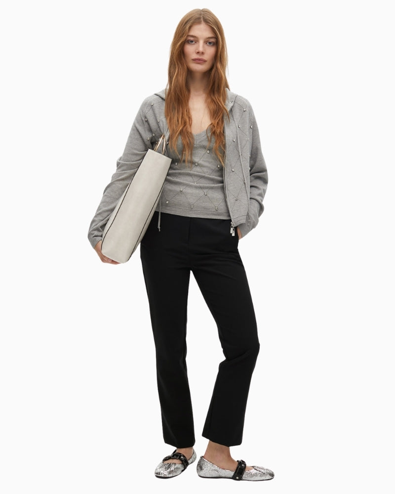 Front view of grey zip gilet styled casually