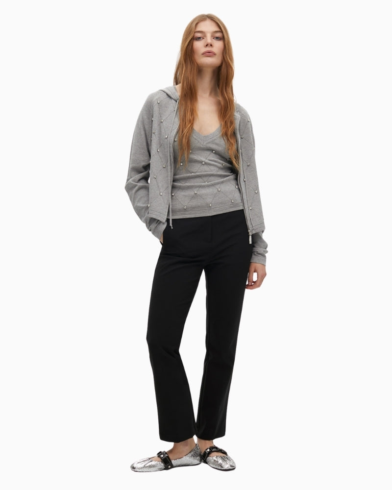 Front view of grey zip gilet styled casually