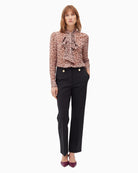 Front view of elegant pull-on trousers styled with blouse