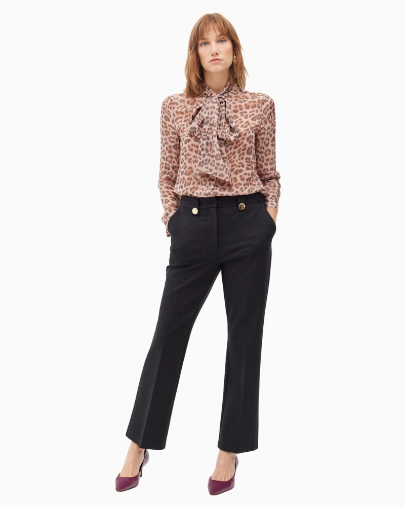 Elegant black knit trousers by Lola Casademunt with gold button detail
