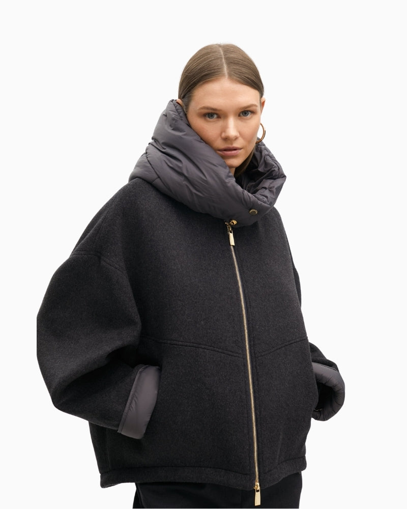 Side view of short overcoat showing clean tailoring and mixed textures