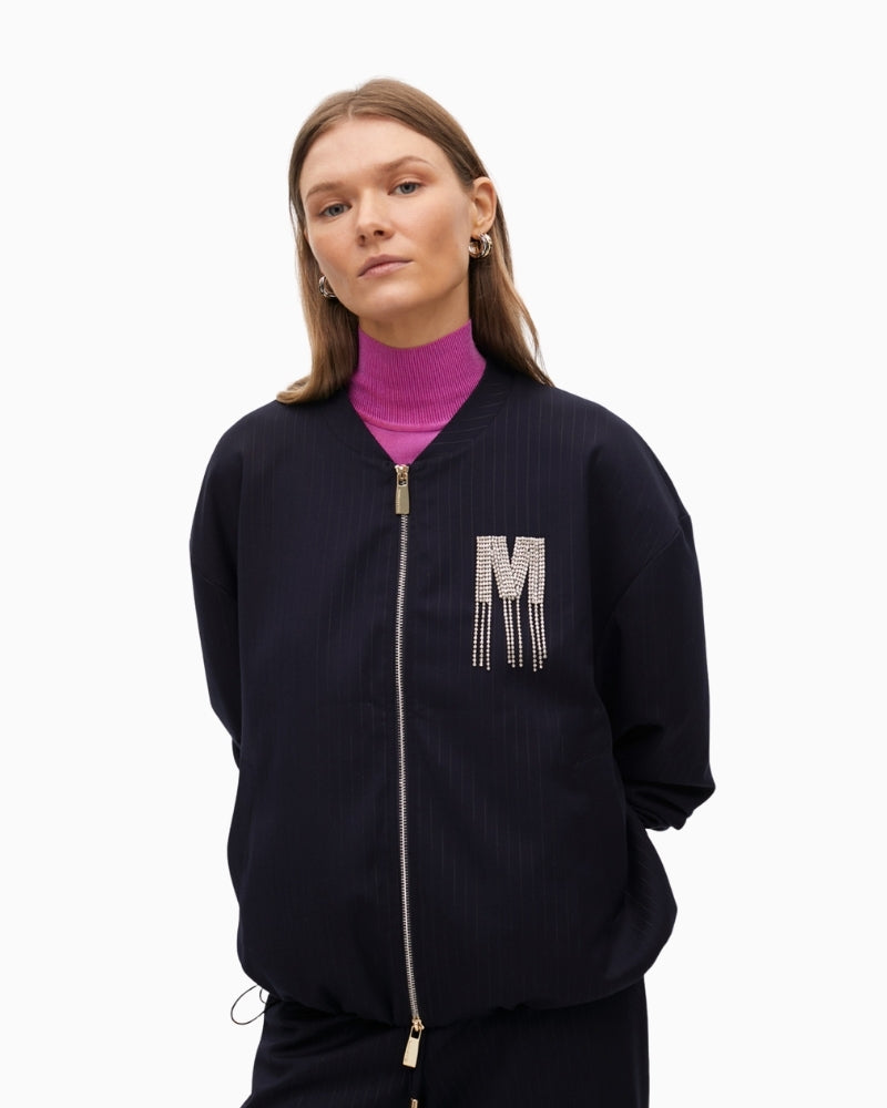 Front view of Lola Casademunt pinstripe bomber with jewel embellishment and zip closure