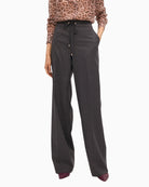 Front view of Lola Casademunt grey wide-leg jeans with stud detail