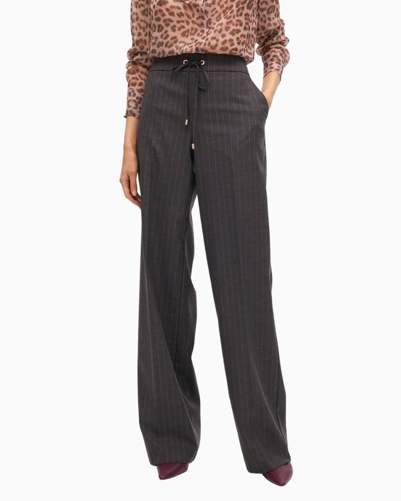 Front view of Lola Casademunt grey wide-leg jeans with stud detail