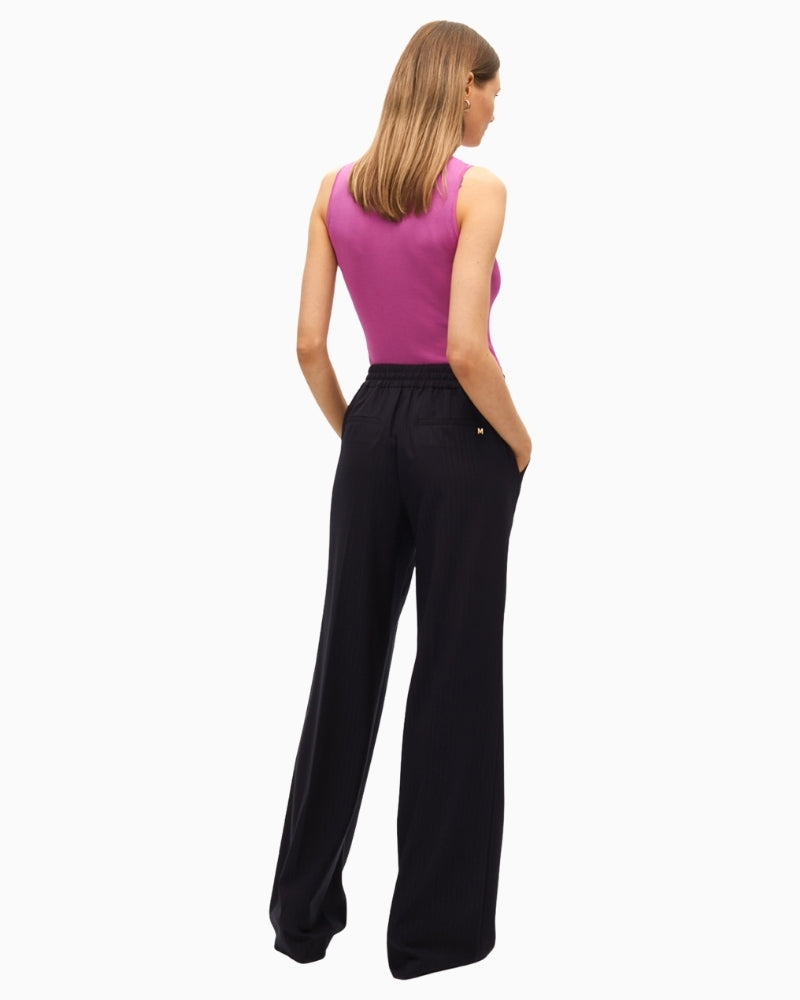 Back view showing straight-leg fit and soft drape