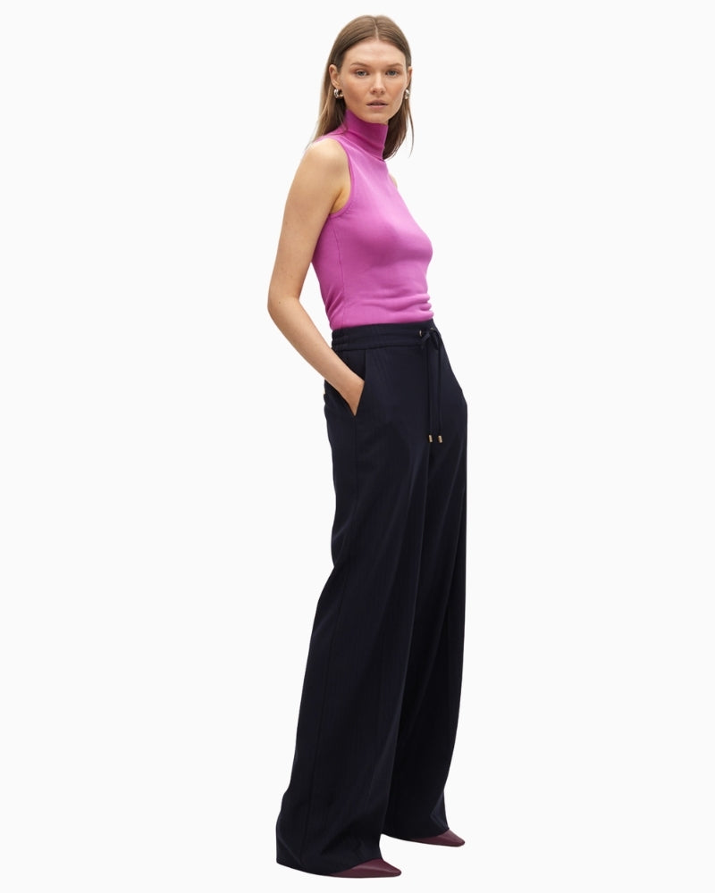 Side view showing straight-leg fit and soft drape