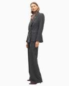 Side view showing stud embellishments and relaxed denim fit