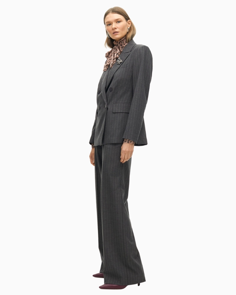 Side view showing stud embellishments and relaxed denim fit