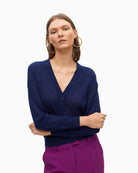 Front view of Lola Casademunt navy cardigan with V-neck and button closure