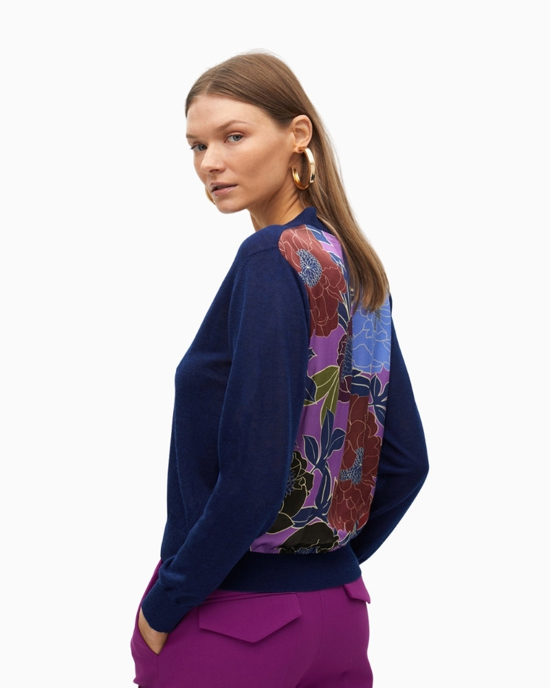 Back view showing vibrant floral print on fine knit cardigan