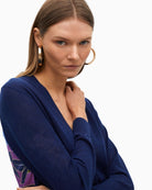Close-up of soft knit fabric and floral detail at back