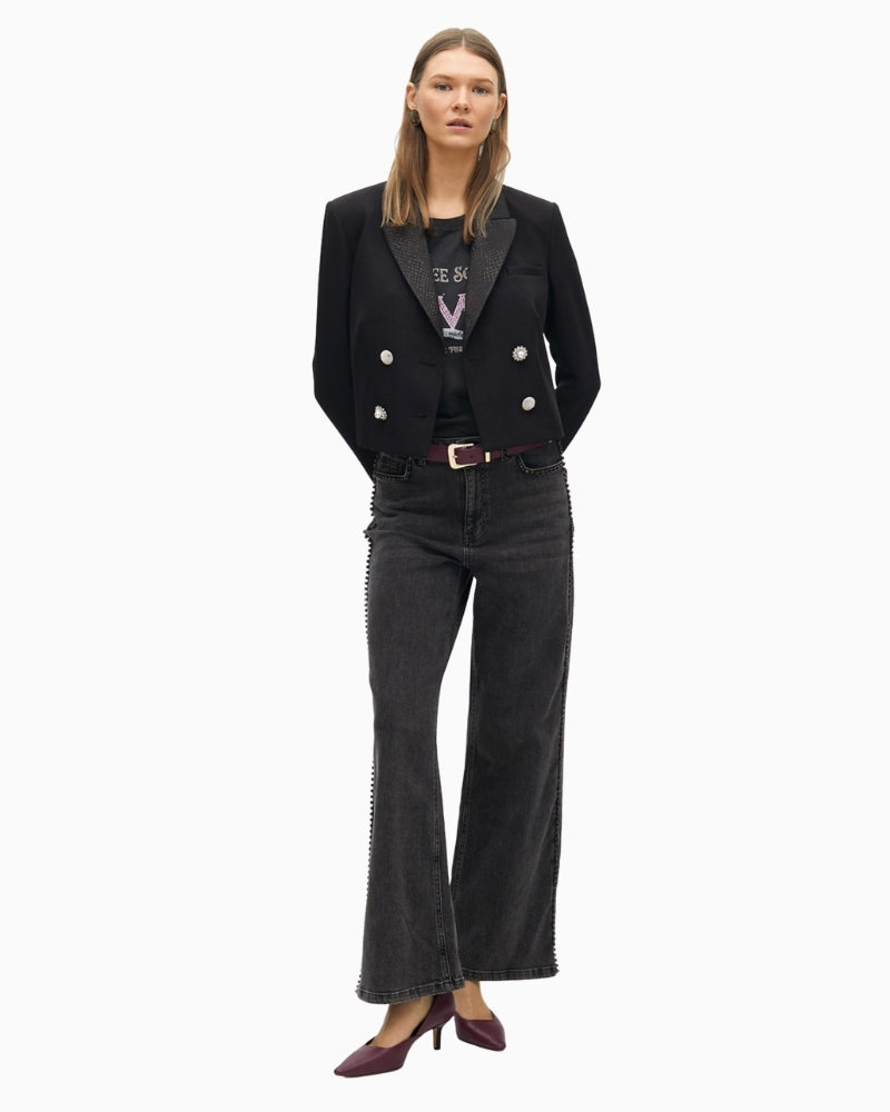 Cropped structured jacket with bold lapel and tailored shape