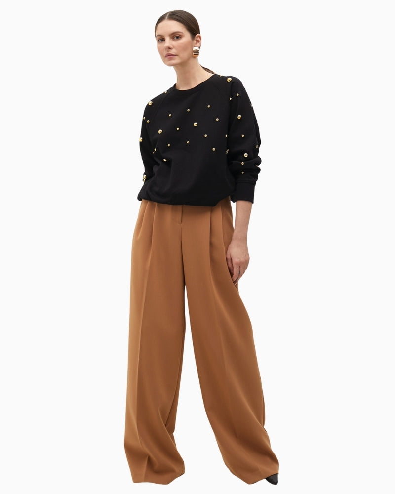 Front view of round neck sweatshirt with evenly spaced golden studs