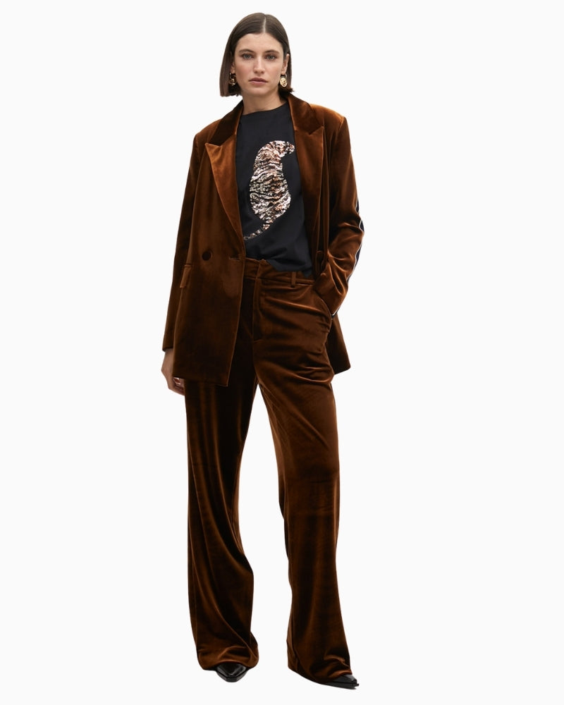 Tiger motif T-shirt styled with black jeans for a bold everyday outfit