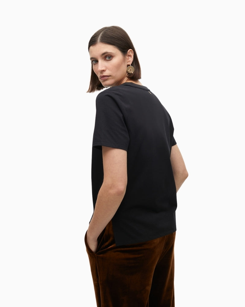Side view showing straight cut and short sleeve design
