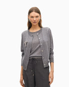 Front view of grey two-piece cardigan by Lola Casademunt with jewel bow detail
