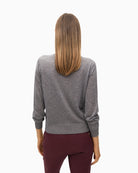 Back view showing relaxed fit and long sleeves