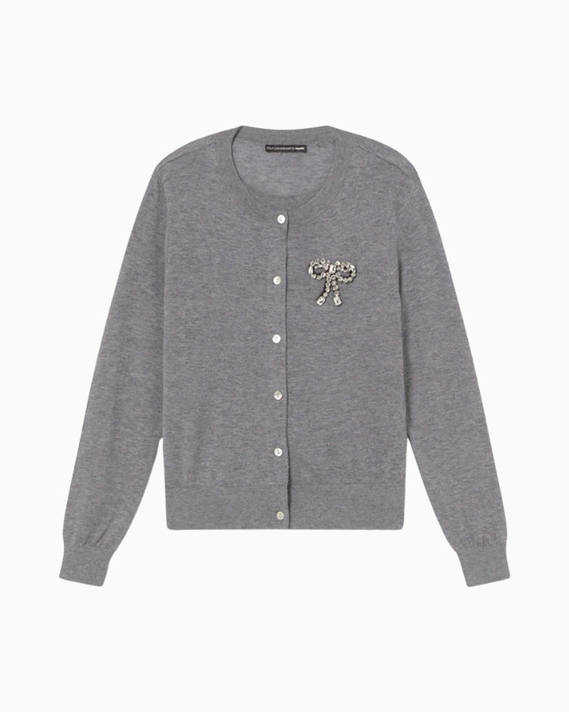 Front view of grey two-piece cardigan by Lola Casademunt with jewel bow detail