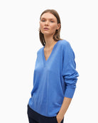 Front view of Lola Casademunt soft blue V-neck jumper with relaxed fit