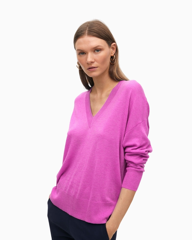 Side view showing slouchy silhouette and long sleeves