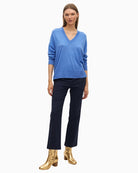 Front view of Lola Casademunt soft blue V-neck jumper with relaxed fit