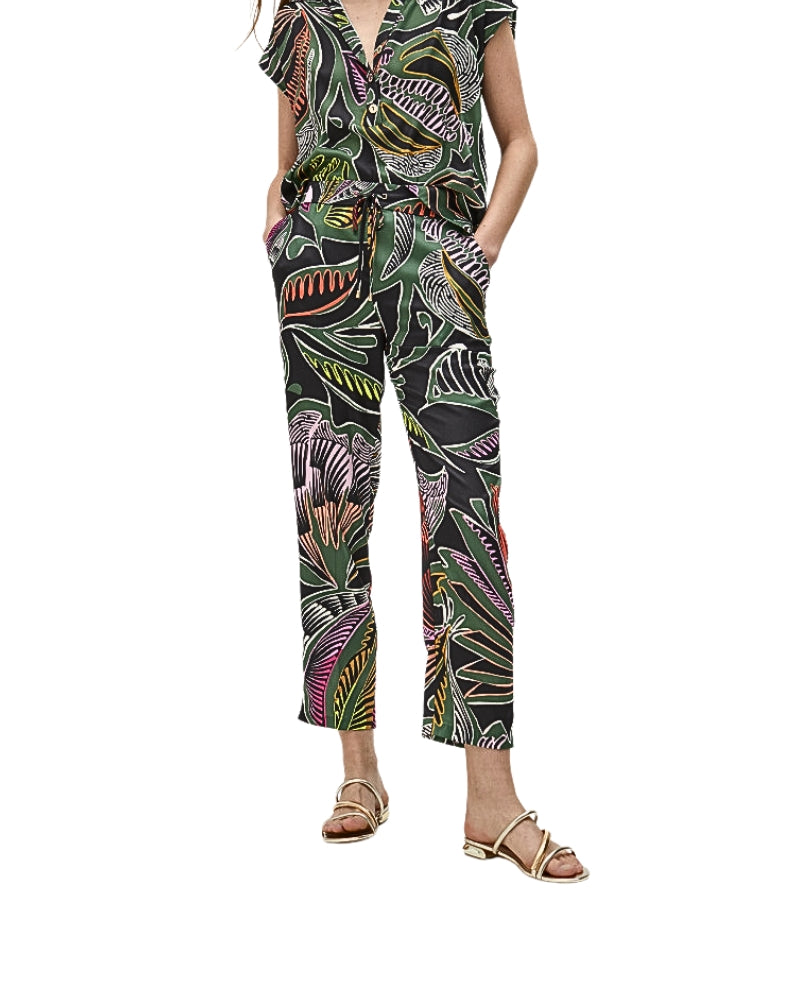Model wearing Lola Casademunt floral print joggers with tapered leg and drawstring waist