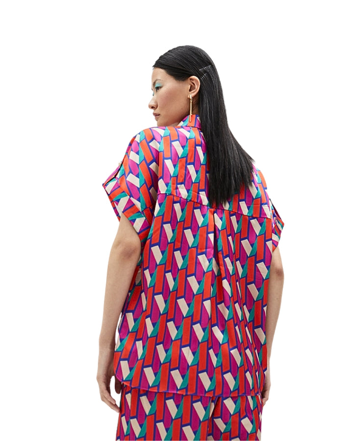 Back view of Lola Casademunt shirt showcasing all-over branded pattern