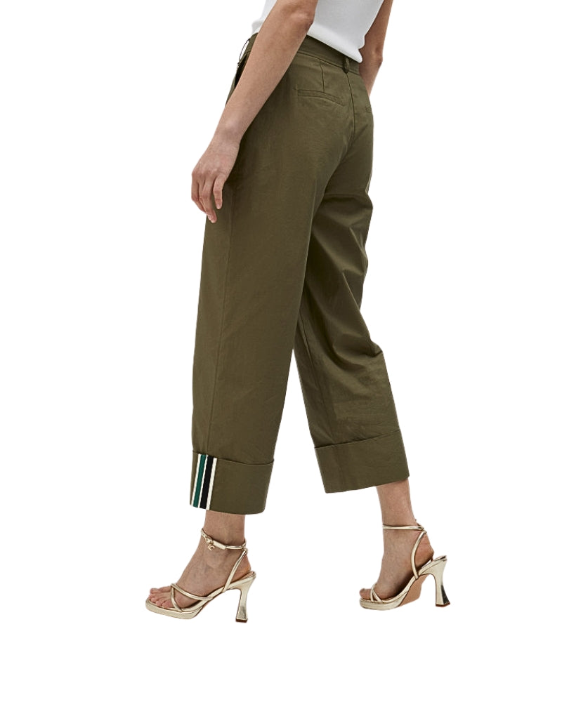 Side view of Lola Casademunt trousers showing relaxed fit and cropped length