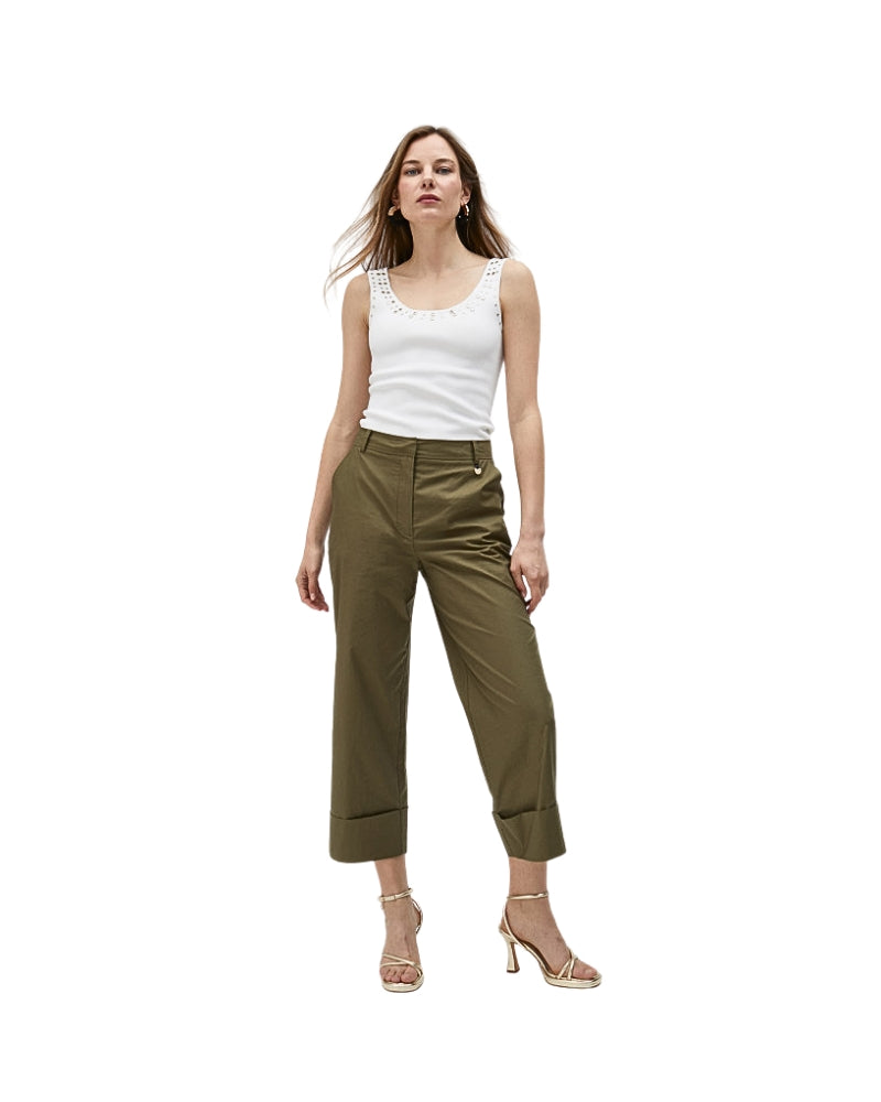Model posing in casual olive poplin trousers with cuffed hem detail
