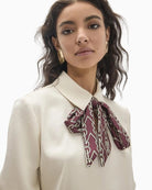 Lola Casademunt Blouse with Bow in cream chain and monogram print detail