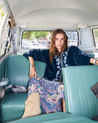 Woman wearing Lollys Laundry Amby blue velvet jacket – Áines Boutique