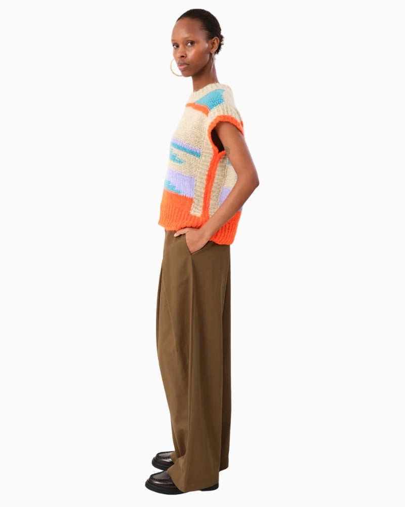 Side view of sleeveless knit showing dropped armholes for easy layering