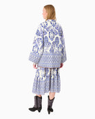 Back view of quilted transitional jacket with long sleeves