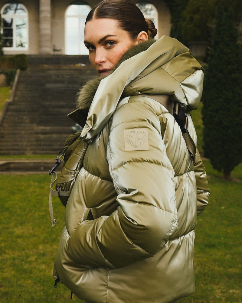 Side view showing shiny satin-look fabric and flattering quilted fit