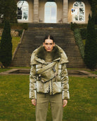 Front view of Marc Aurel shimmer puffer jacket with faux fur hood and zip pockets
