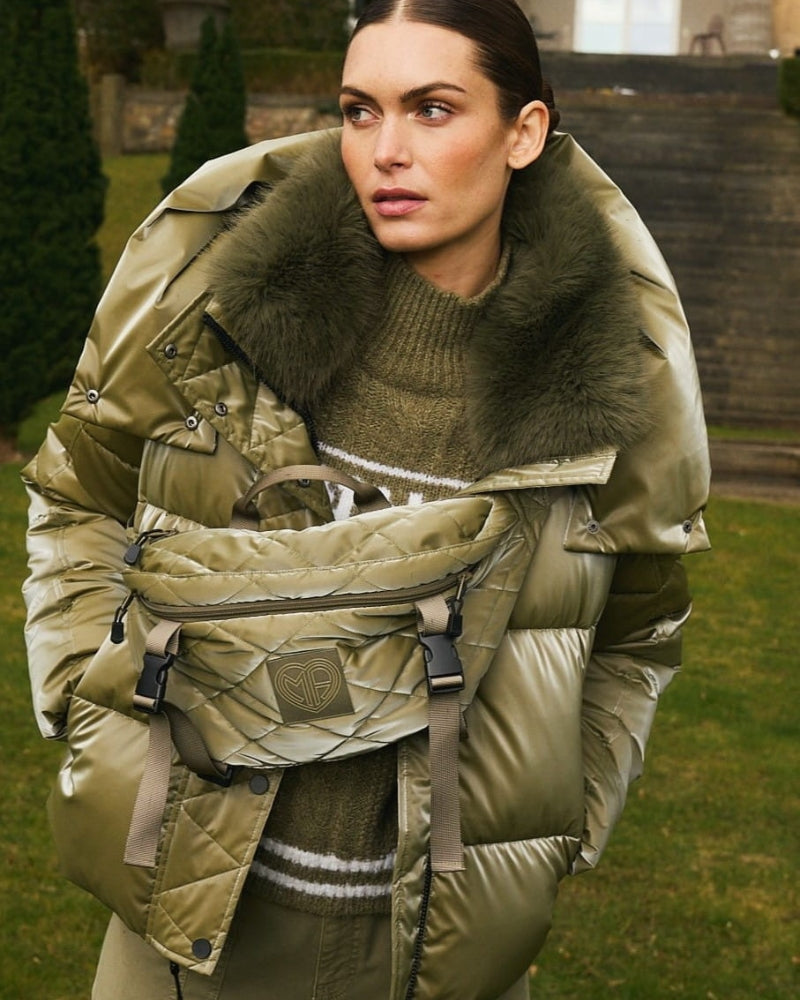 Front view of Marc Aurel shimmer puffer jacket with faux fur hood and zip pockets