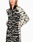 Side view of animal print bomber jacket with relaxed, cropped fit