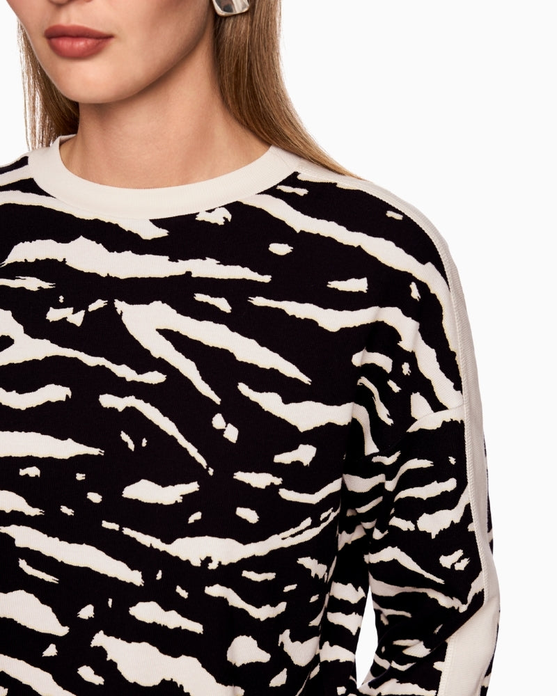 Close-up of soft ribbed fabric and animal print detail