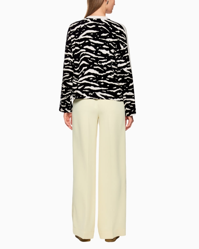 Back view of long-sleeve shirt showing relaxed cut and wide sleeves