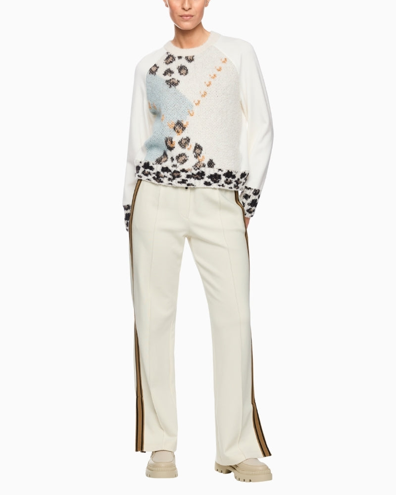 Marc Cain argyle knit styled with wide-leg trousers for a modern winter look