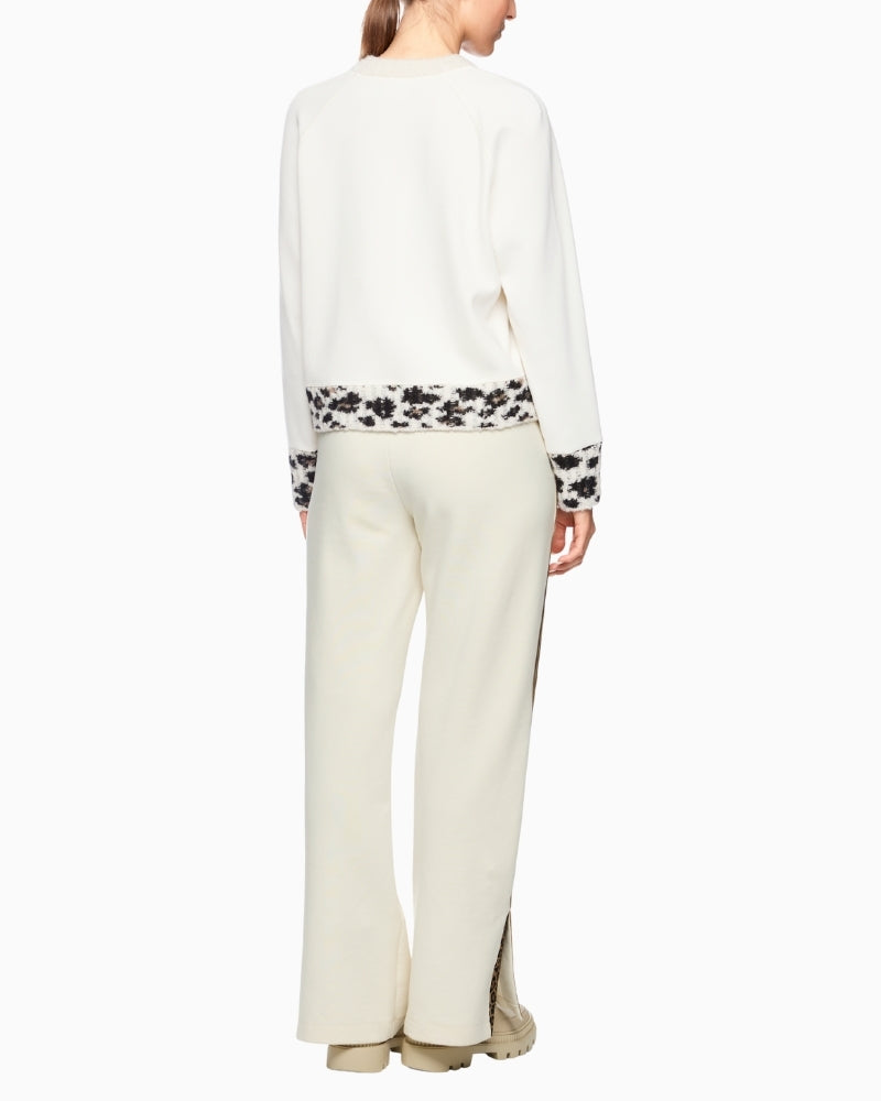 Back view of jumper showing soft stretch fabric in contrast texture