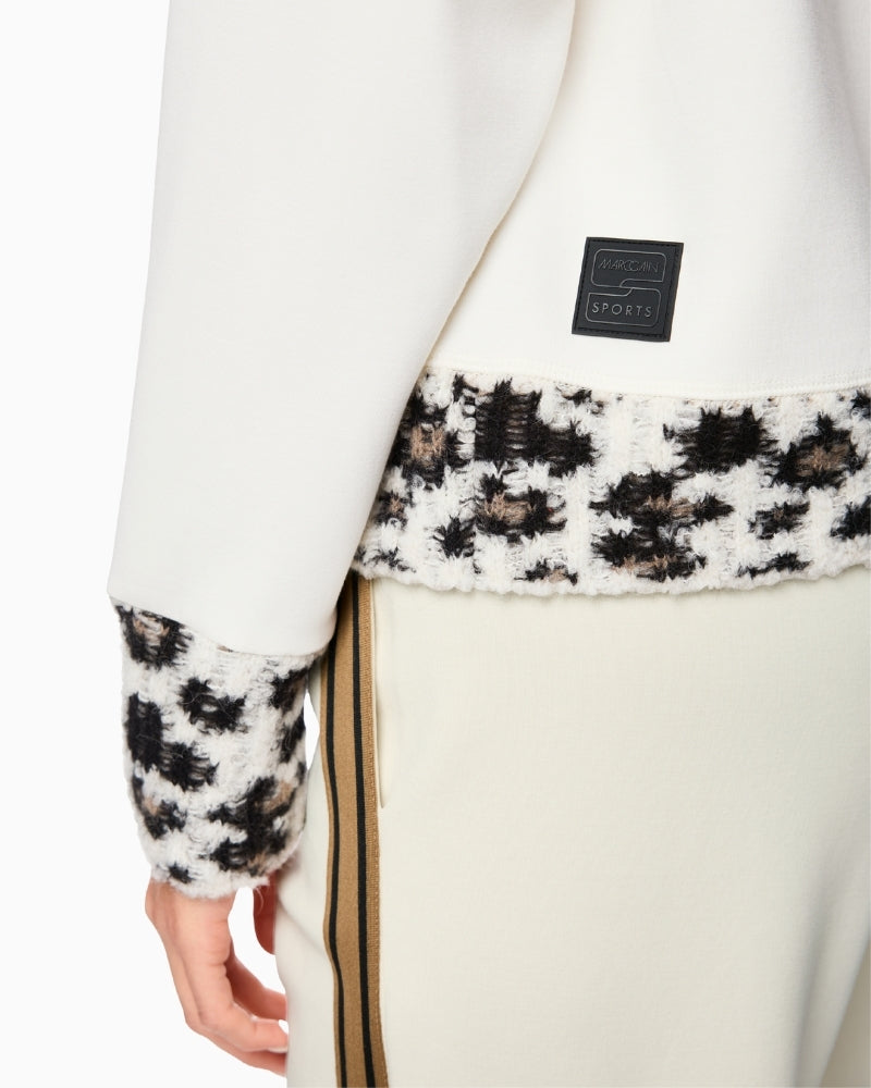 Close-up of alpaca and wool knit texture on front and cuffs