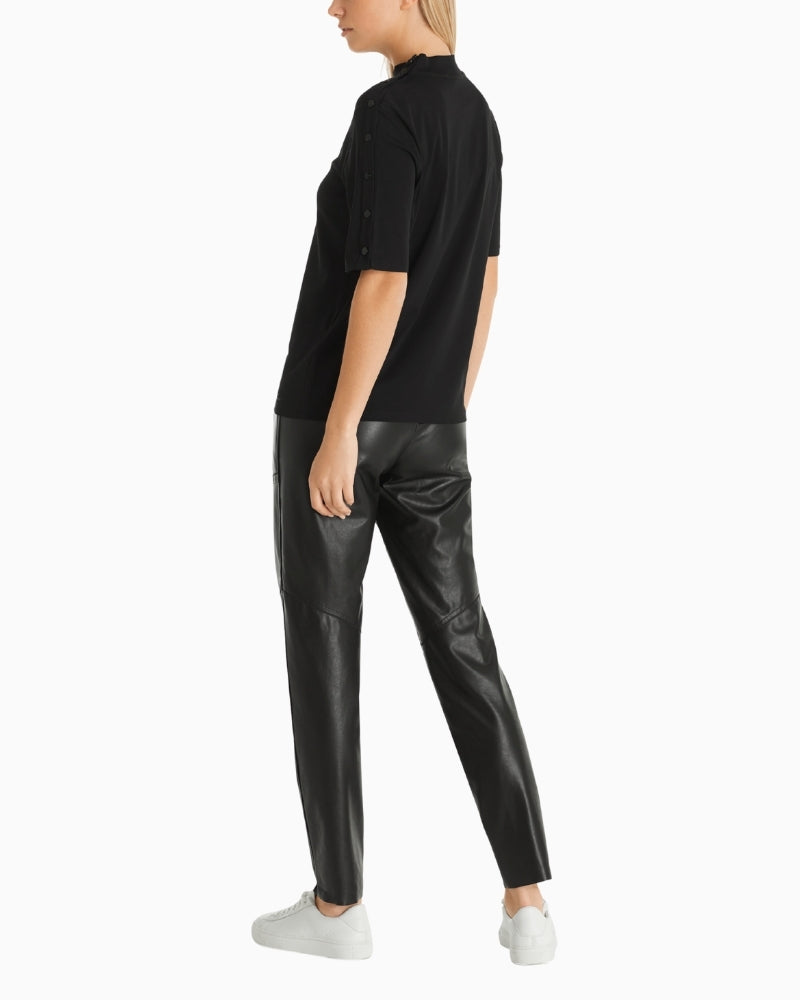 Side view showing slim fit and short sleeves on Marc Cain tee