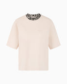 Front view of straight-cut Marc Cain tee with Sport logo detail