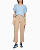 Woman wearing Marc Cain beige trousers full outfit front view – Áines Boutique