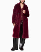 Front view of Marc Cain fluffy maroon coat with wide fit and four-button fastening